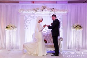 Bride and Groom exchanging rings