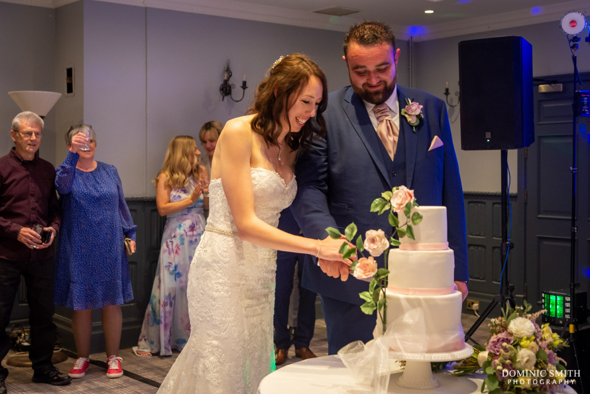 Cake cutting at Stanhill Court Wedding