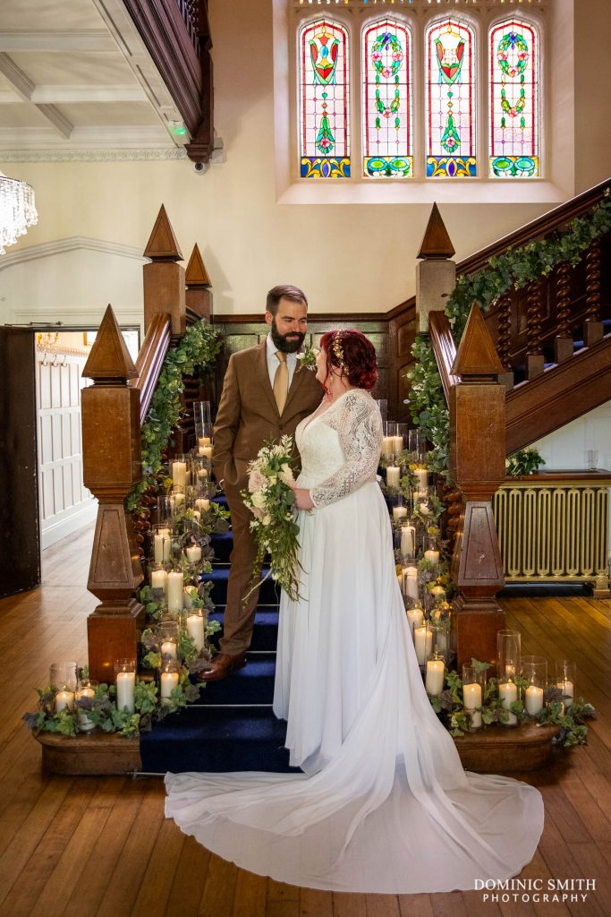 Wedding Couple Photography on the stairs at Highley Manor in Sussex