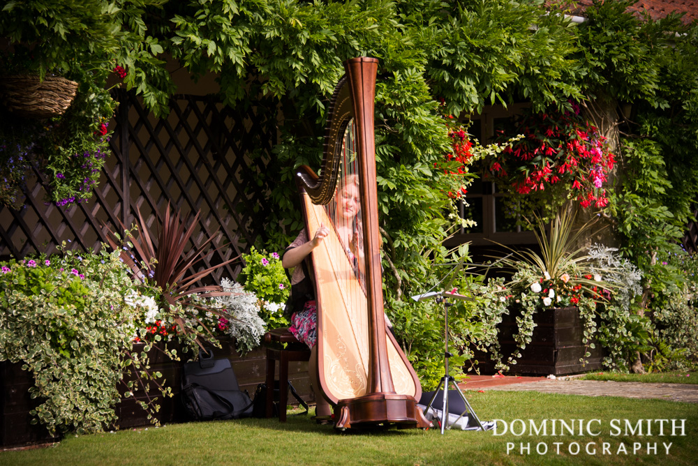 Harpist playing at an Ashdown Park Wedding