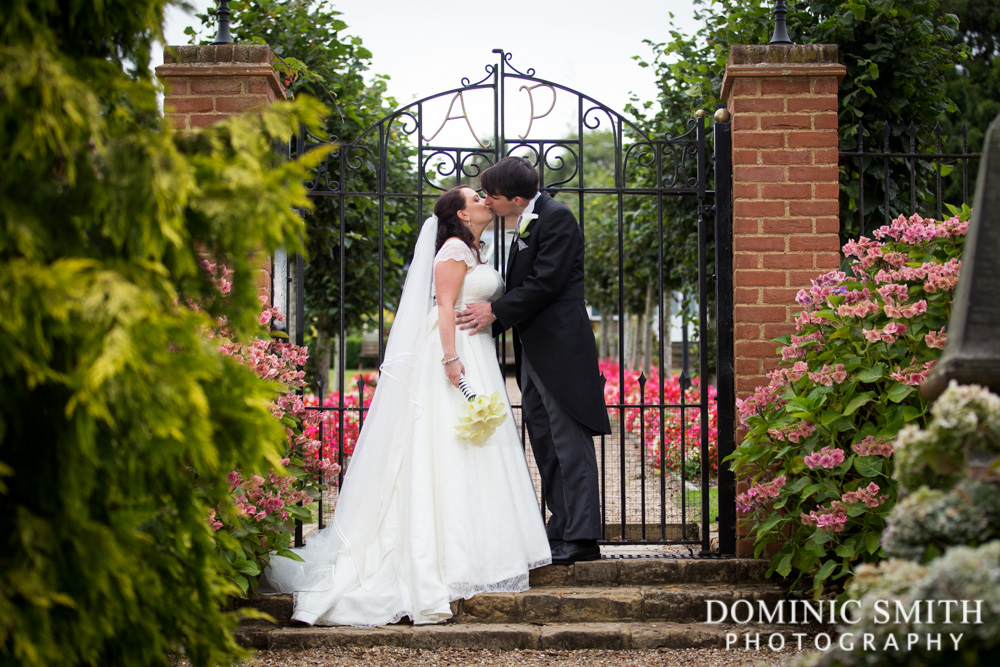 Romantic wedding moment in the gardens at Ashdown Park Hotel in Sussex
