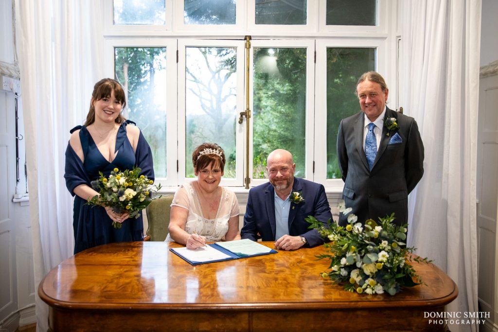 Signing the Register at a Highley Manor Wedding