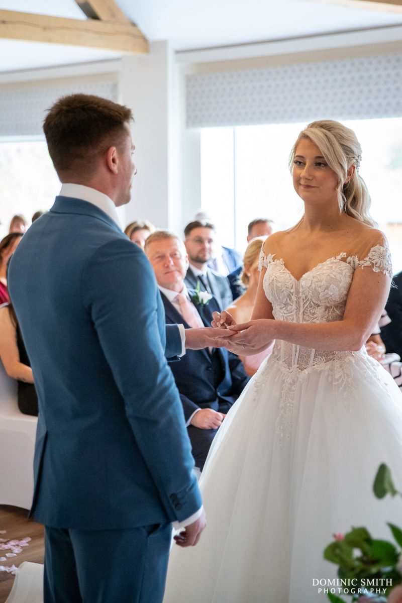 Exchanging the Rings at Cottesmore Hotel, Golf and Country Club, Sussex
