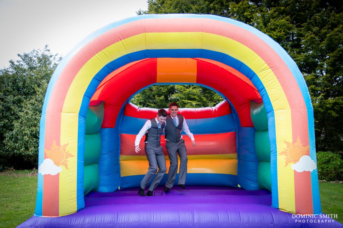 Grooms on the Bouncy Castle