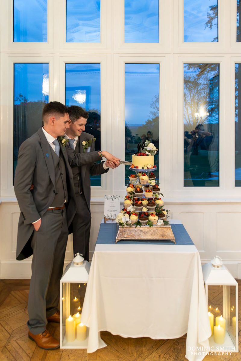 Grooms cutting the cake at Highley Manor