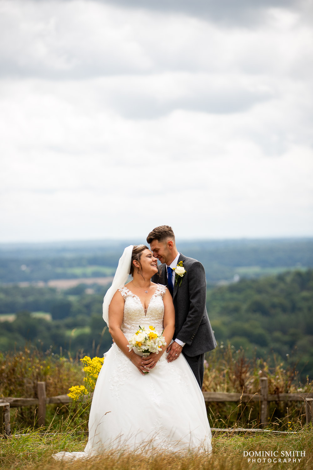 Wedding Couple Photo at Box Hill Surrey with storm clouds behind