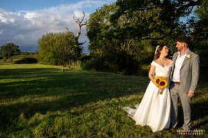 Sunlight Wedding Couple image at Bysshe Court Barn in Surrey