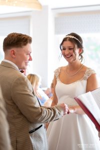 Exchanging the wedding rings at Cottesmore Golf Club