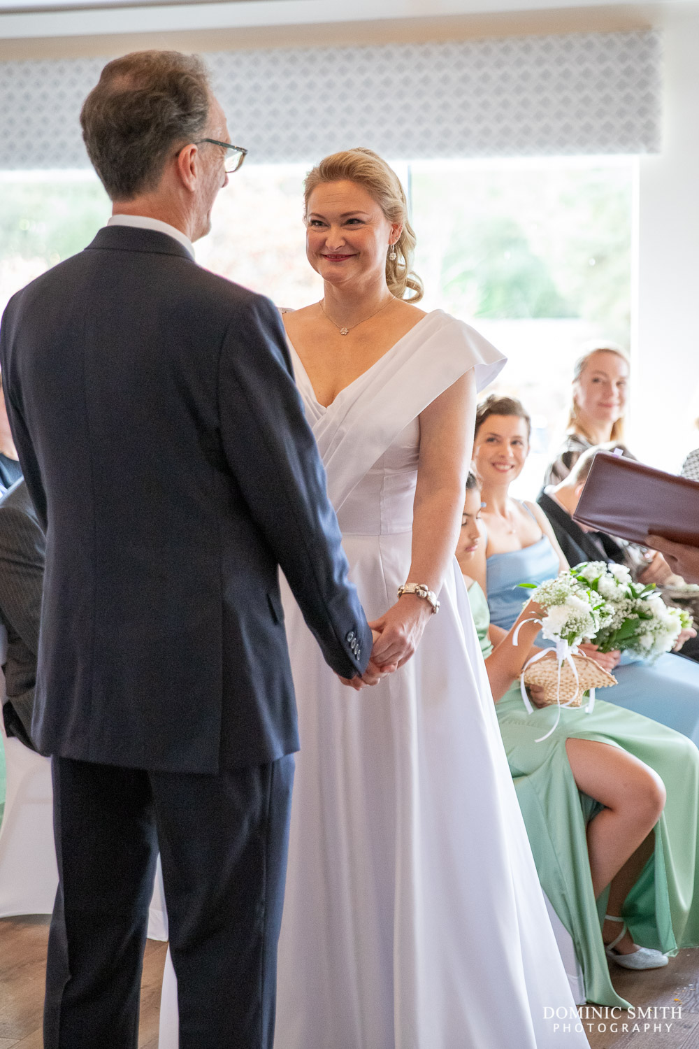 Bride and Groom holding hands at Cottesmore Hotel Golf and Country Club