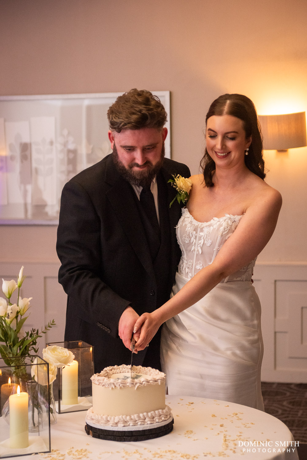 Bride and Groom cut their wedding cake