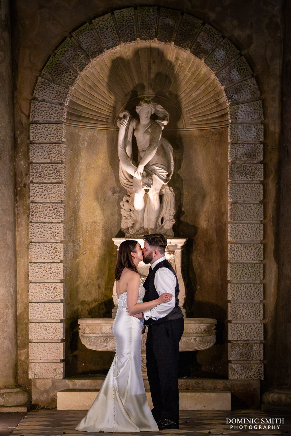 Bride and Groom kiss on their wedding night at Wotton House Wedding Venue in Surrey