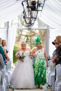 Bride escorted by her Mum at Stanhill Court Hotel
