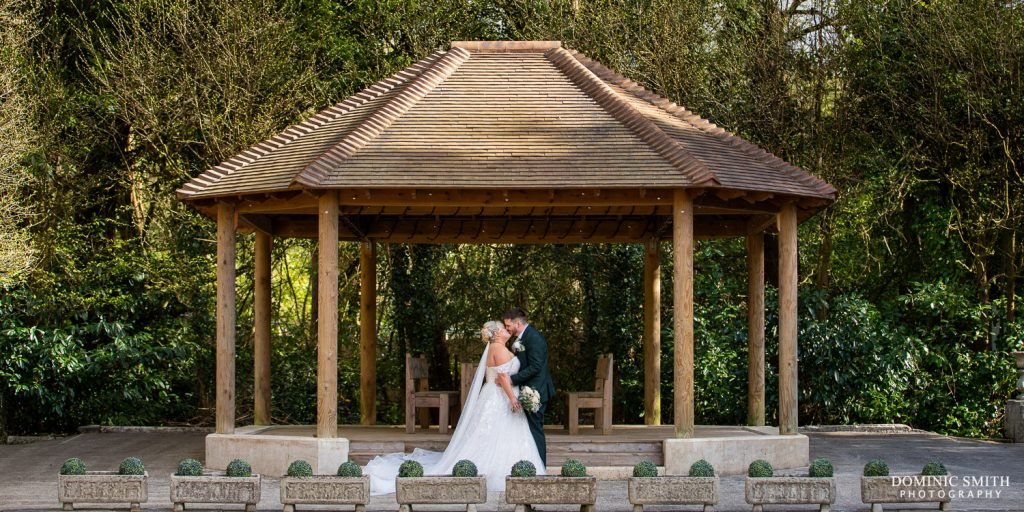 Outside amphitheatre wedding couple photo at Stanhill Court Hotel