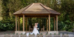 Outside amphitheatre wedding couple photo at Stanhill Court Hotel