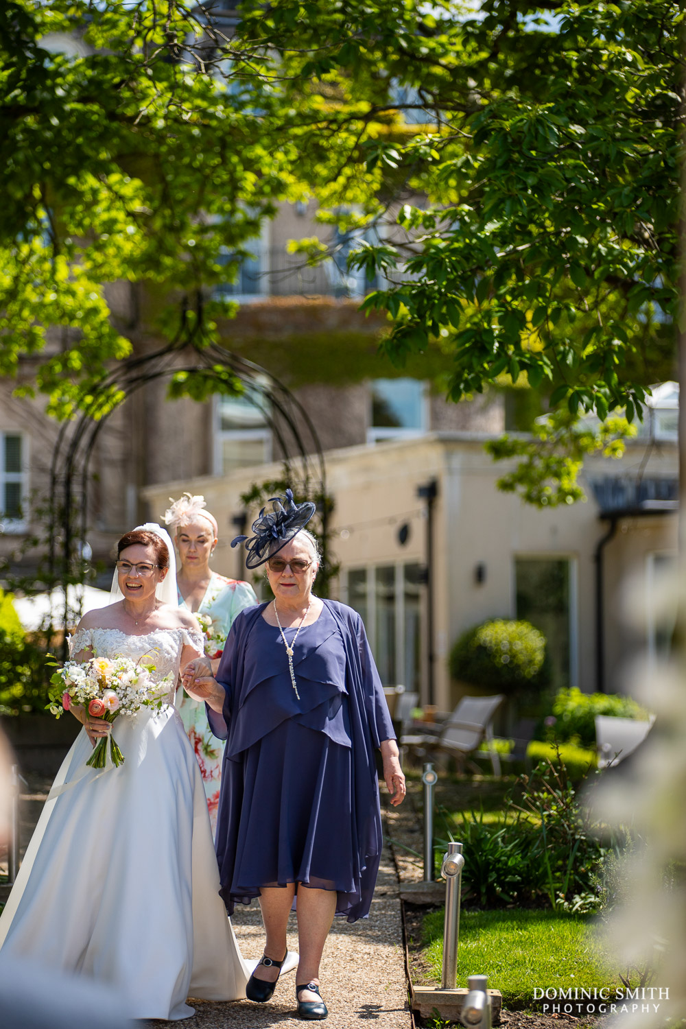 Bride walking down the aisle at The Spa Hotel