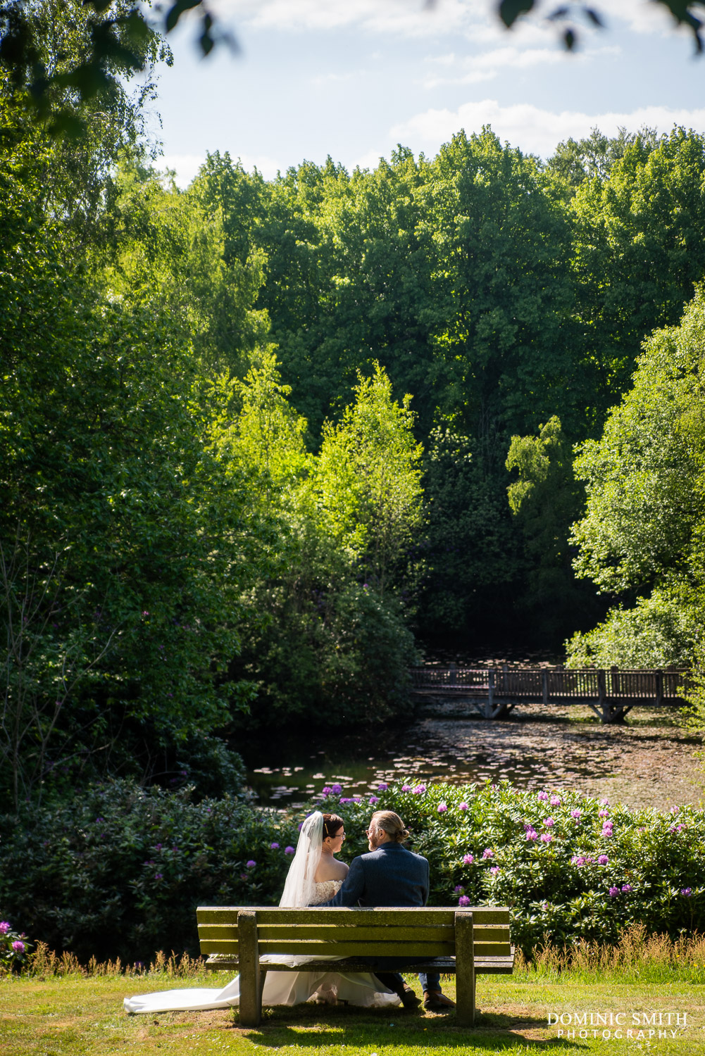 Wedding Couple looking over the Spa Hotel Lake in Tunbridge Wells
