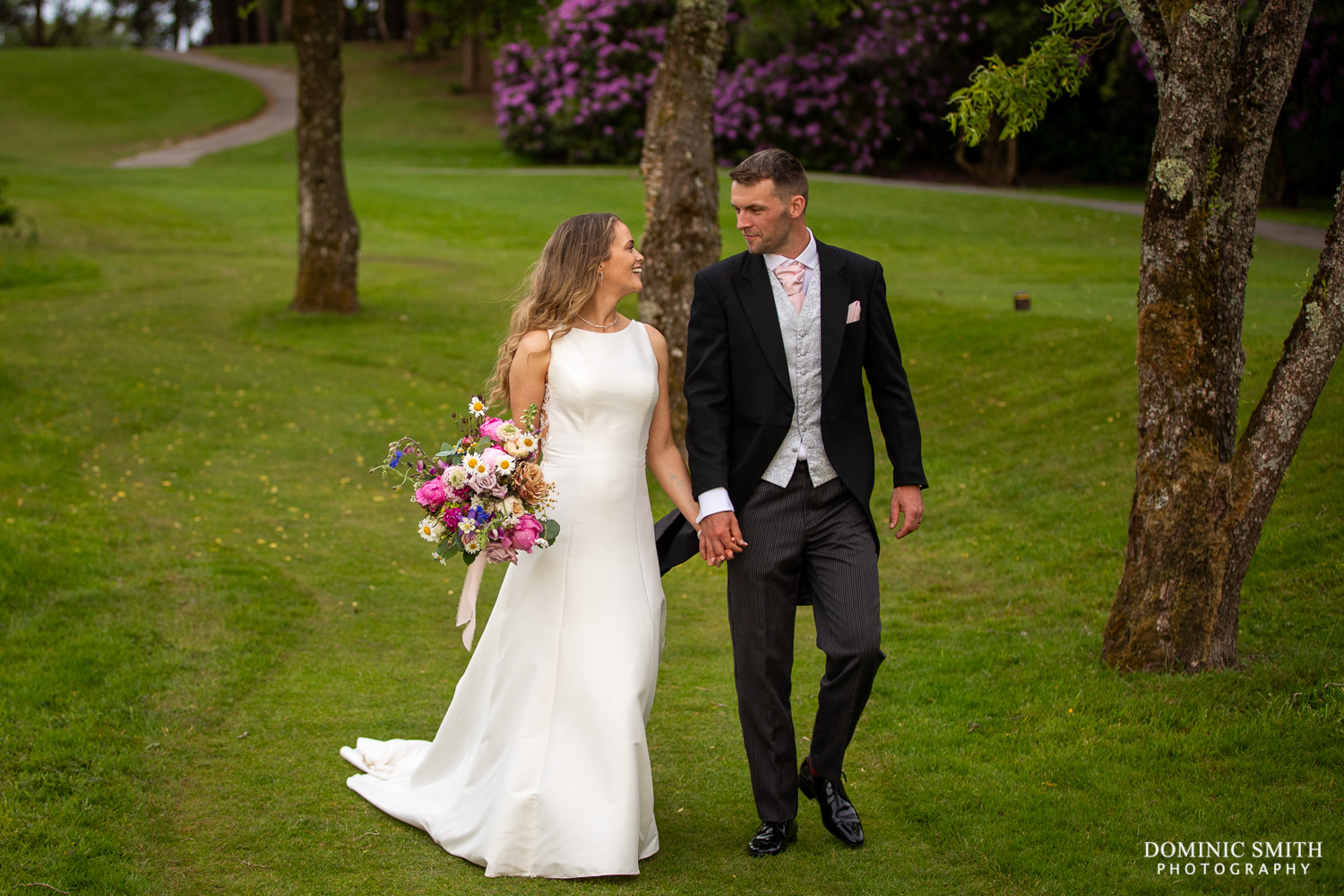 Wedding Couple walking at Cottesmore Golf Club