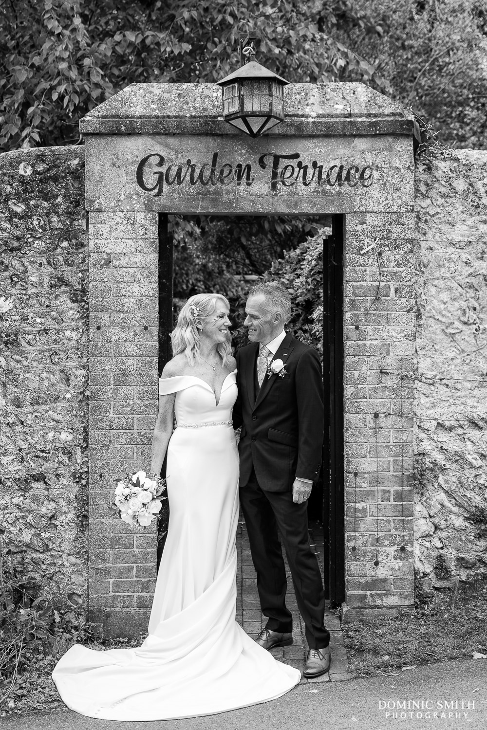 Black and White Wedding Couple Photograph taken at the gateway to Wingrove House