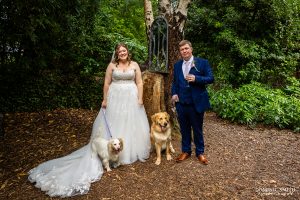 Bride and Groom pose with their dogs on their wedding day at Highley Manor