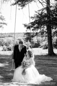 Black and White photo of the Bride and Groom on the swing at Highley Manor