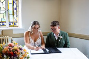 Signing the register at Glenmore House