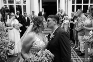 Two brides share a kiss at Glenmore House