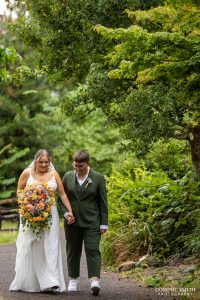 Brides walking through Claremont Gardens