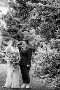 Black and White photo of Brides walking through Claremont Gardens