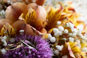 Wedding rings on the brides bouquet