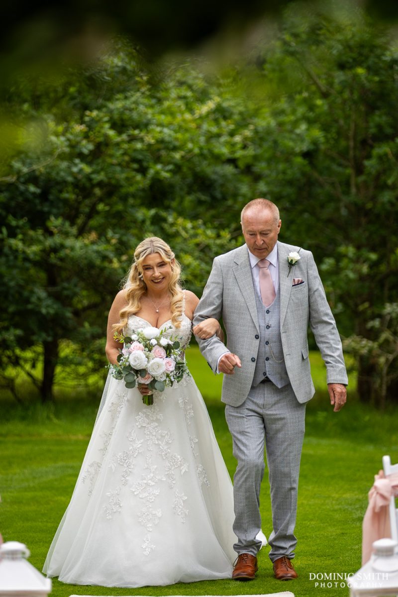 Father walking the bride down the aisle at Cottesmore