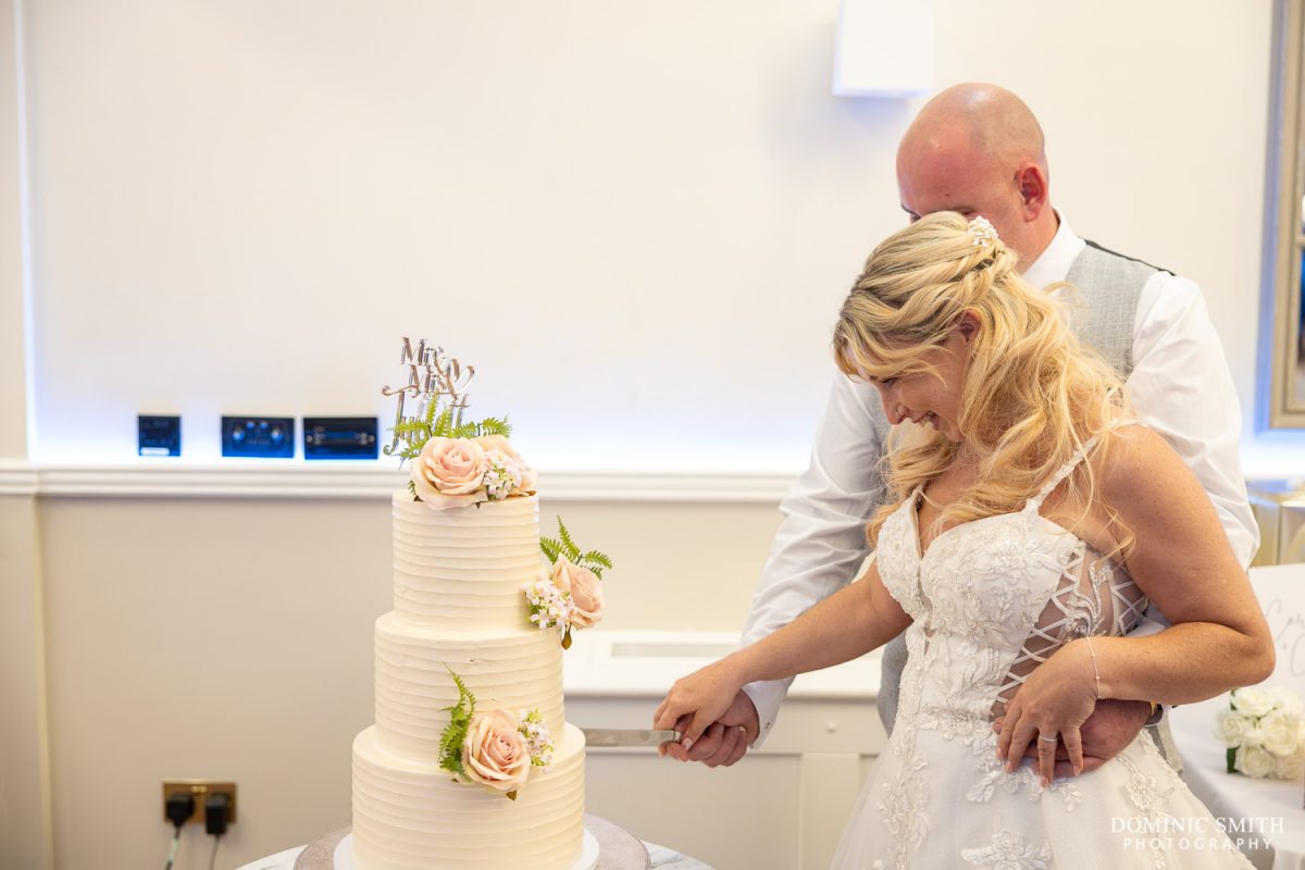 Cutting the Wedding Cake at Cottesmore Golf Club in Sussex