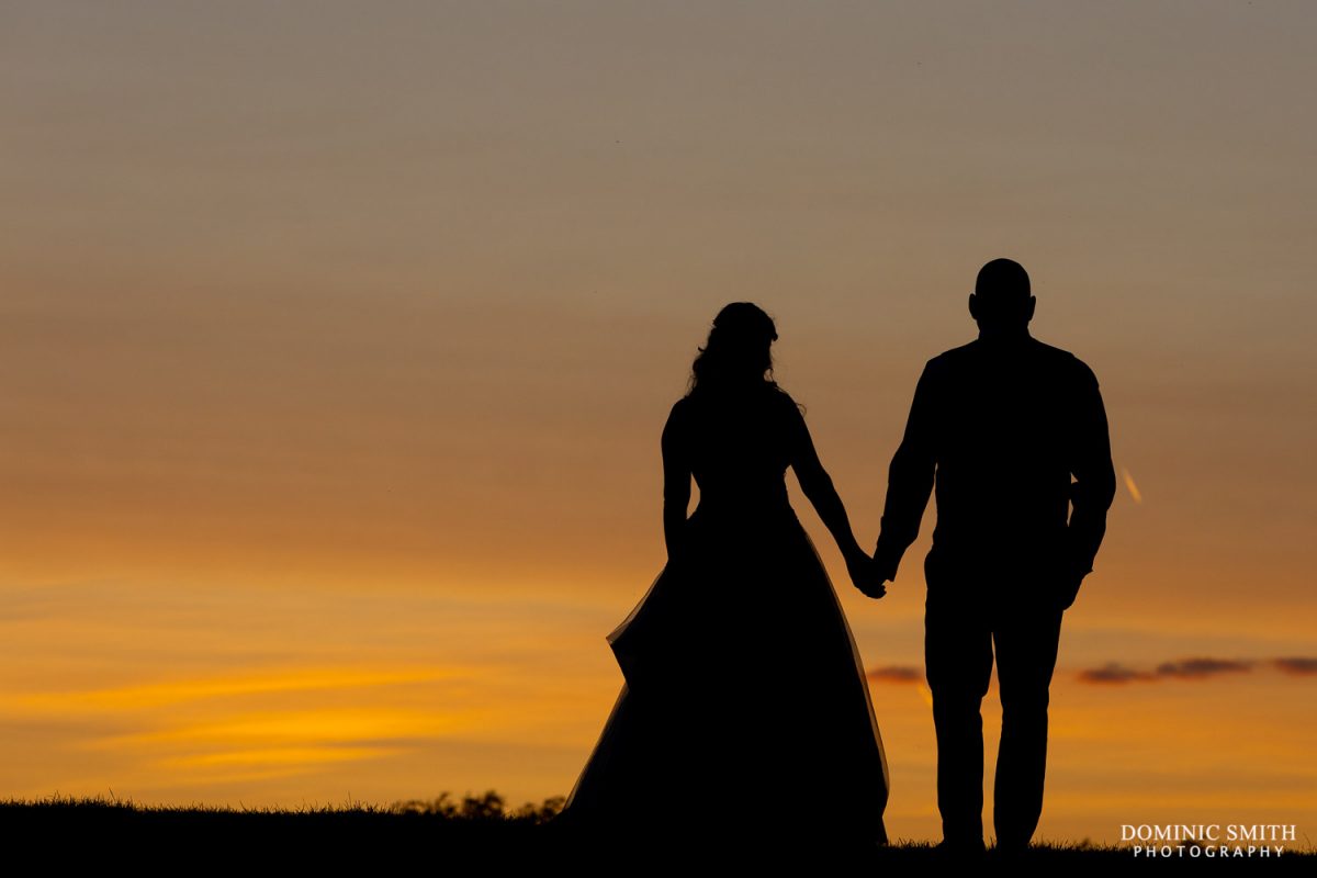 Bride and Groom during sunset at Cottesmore Hotel, Golf and Country Club, Sussex