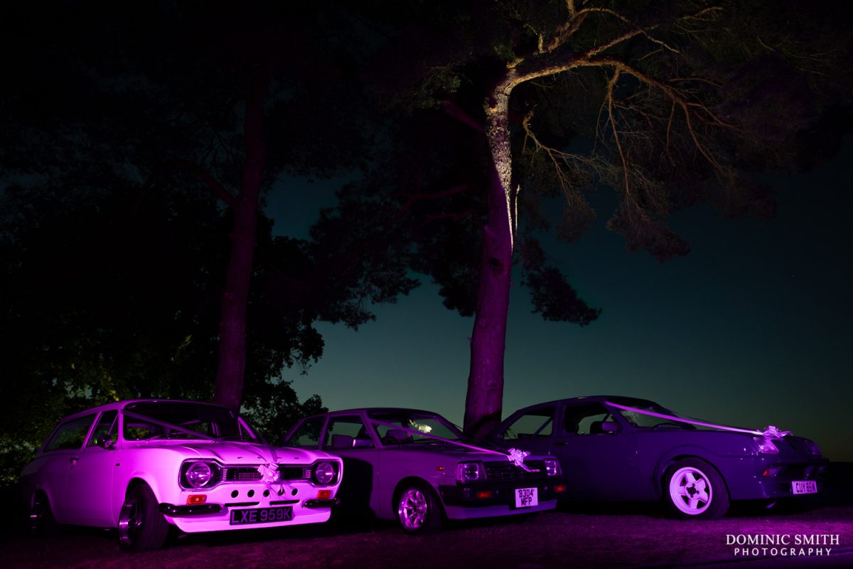 Night photo of the wedding cars taken at Cottesmore Golf Club