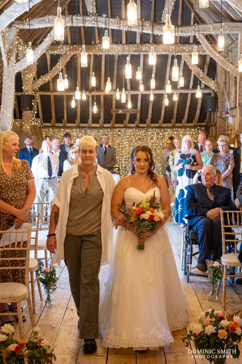 Bride walking down the aisle at Southlands Barn