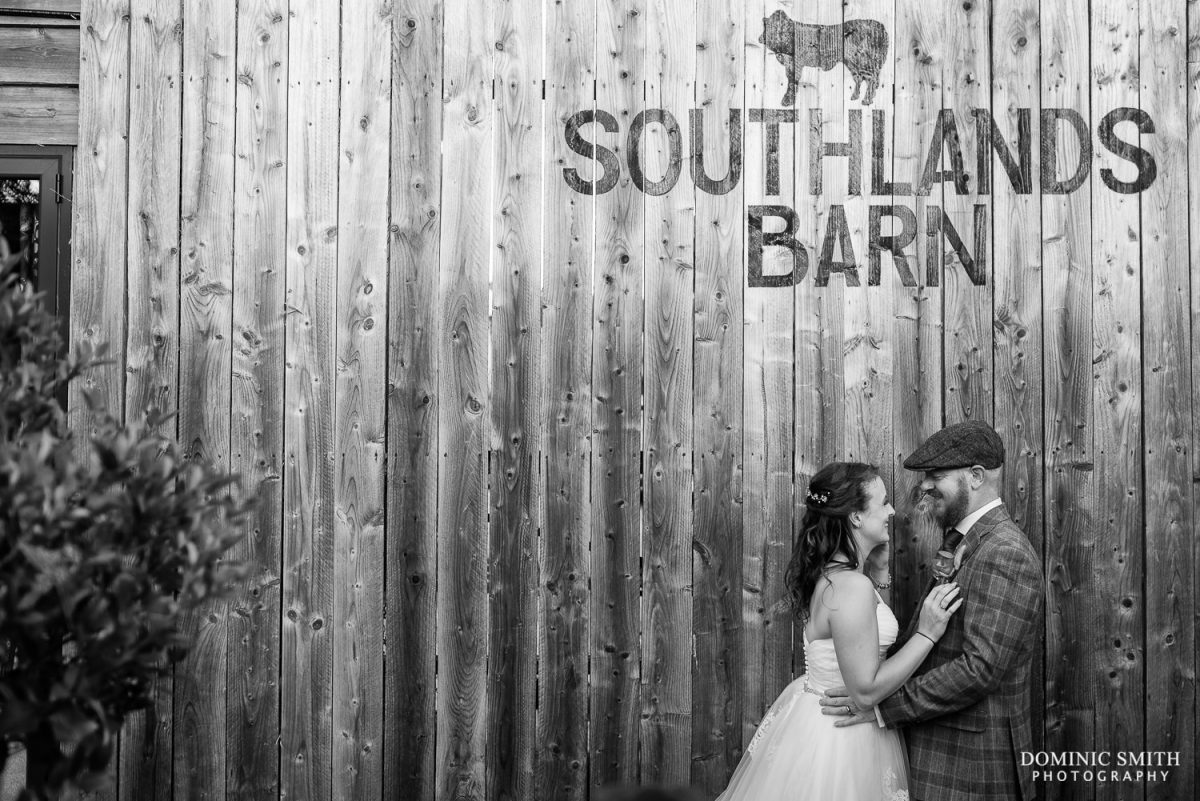 Black and White Wedding Couple Photo in front of the Southlands Barn sign