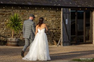 Bride and Groom walk back to Southlands Barn