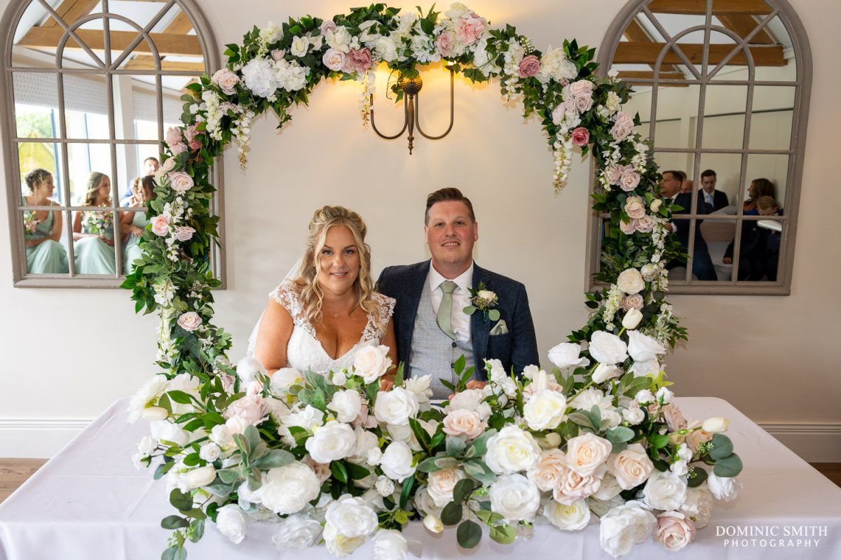 Signing the Wedding register at Cottesmore Golf Club