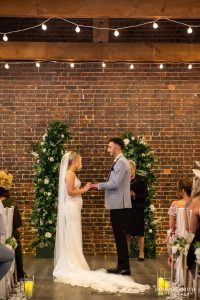 Bride and Groom exchanging their rings at One Warwick Park Hotel