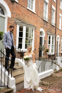 Bride and Groom posing on door steps in Tunbridge Wells