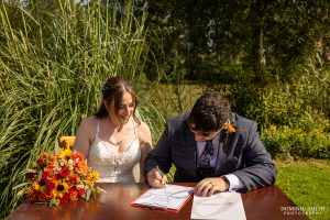 Signing the wedding register at Millwards Estate, Sussex