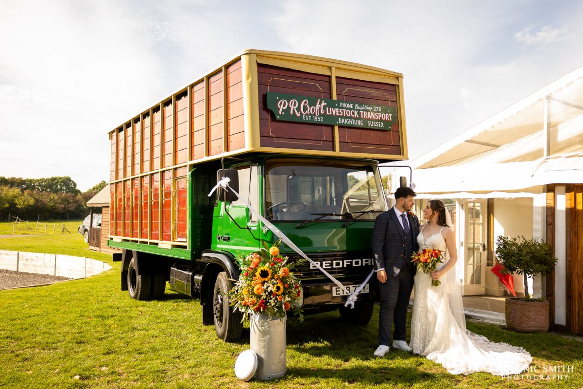 Bride and Groom in front of the Bridal Lorry at Millwards Estate