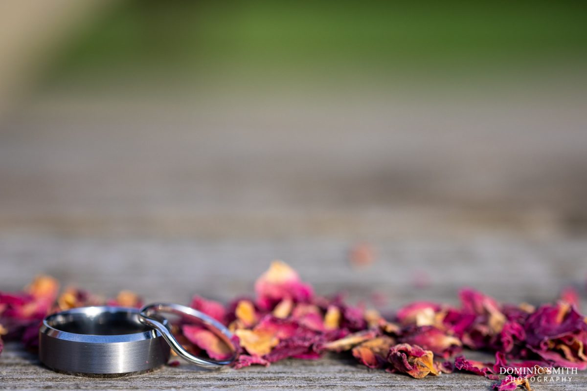 Wedding Rings with confetti at Millwards Estate