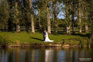 Bride and Groom at the lake at Millwards Estate