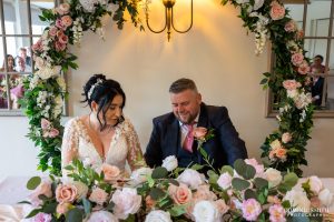 Signing the wedding register at Cottesmore Golf Club
