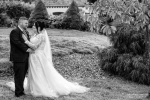 Black and white portrait of the bride and groom at Cottesmore Golf Club