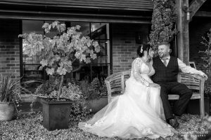 Black and White Couple Photo outside Cottesmore Golf Club