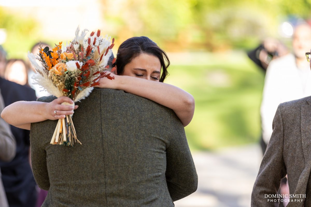 Bride hugging her Groom at Highley Manor