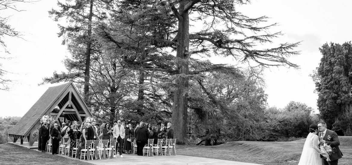 Bride and Groom with their guests outside the Highley Manor Pavilion