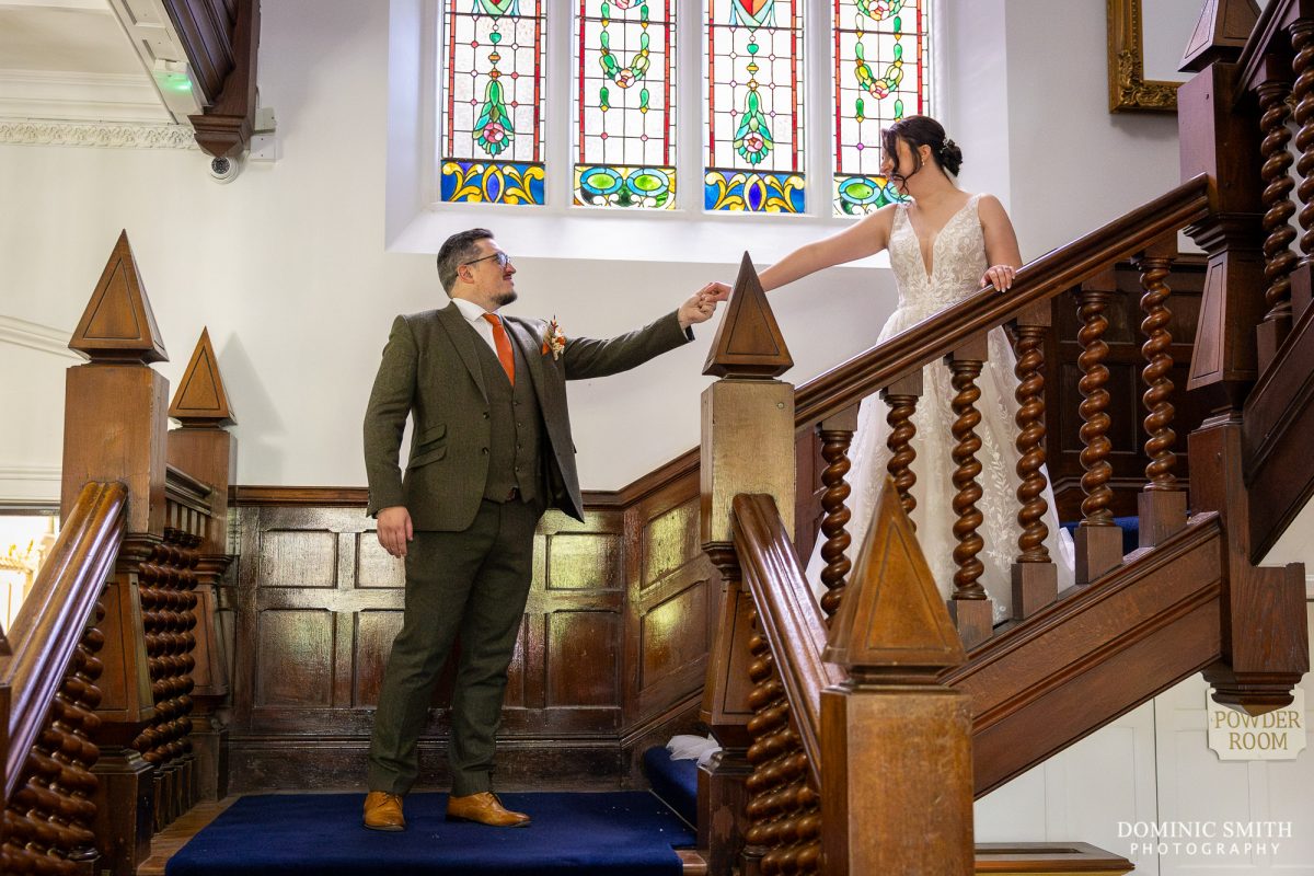 Bride and Groom come down the Highley Manor Staircase
