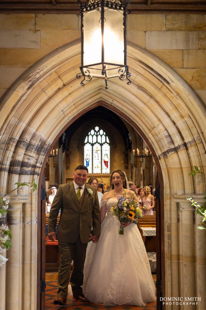 Bride and Groom exiting St Margarets Church in Horhsam